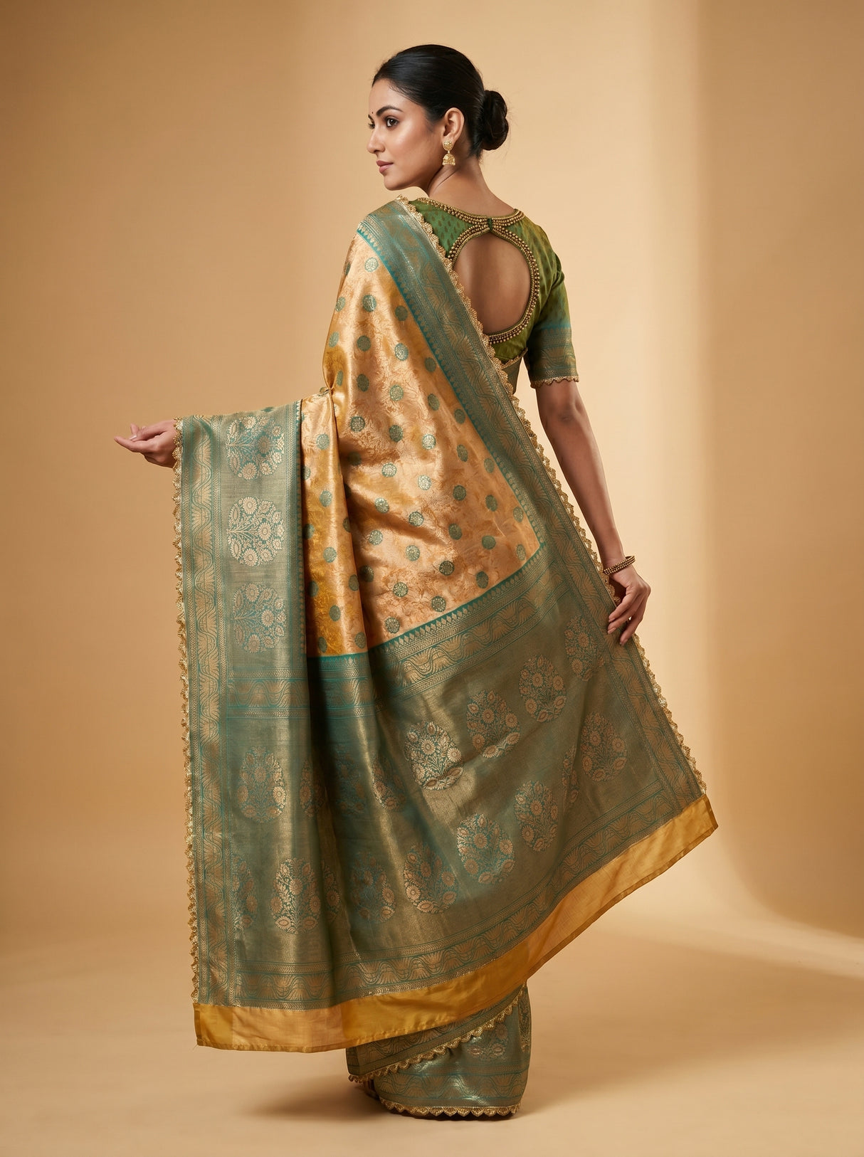 MIMOSA Gold Kanjivaram Art Silk Saree — mid-section showing border and hand