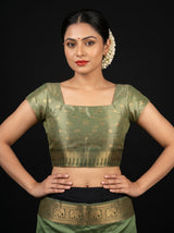 MIMOSA Green Banarasi Art Silk Saree - close-up of hand and bangles near stairs