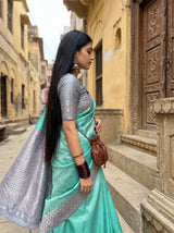 MIMOSA Rama Kanjivaram Art Silk Saree — close-up of face and earrings