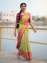 MIMOSA Parrot Green Kanjivaram Art Silk Saree — close-up of model's hand on railing