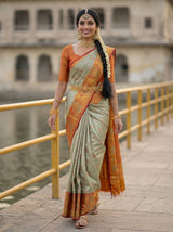 MIMOSA Pista Kanjivaram Art Silk Saree — close-up of model's hand on railing