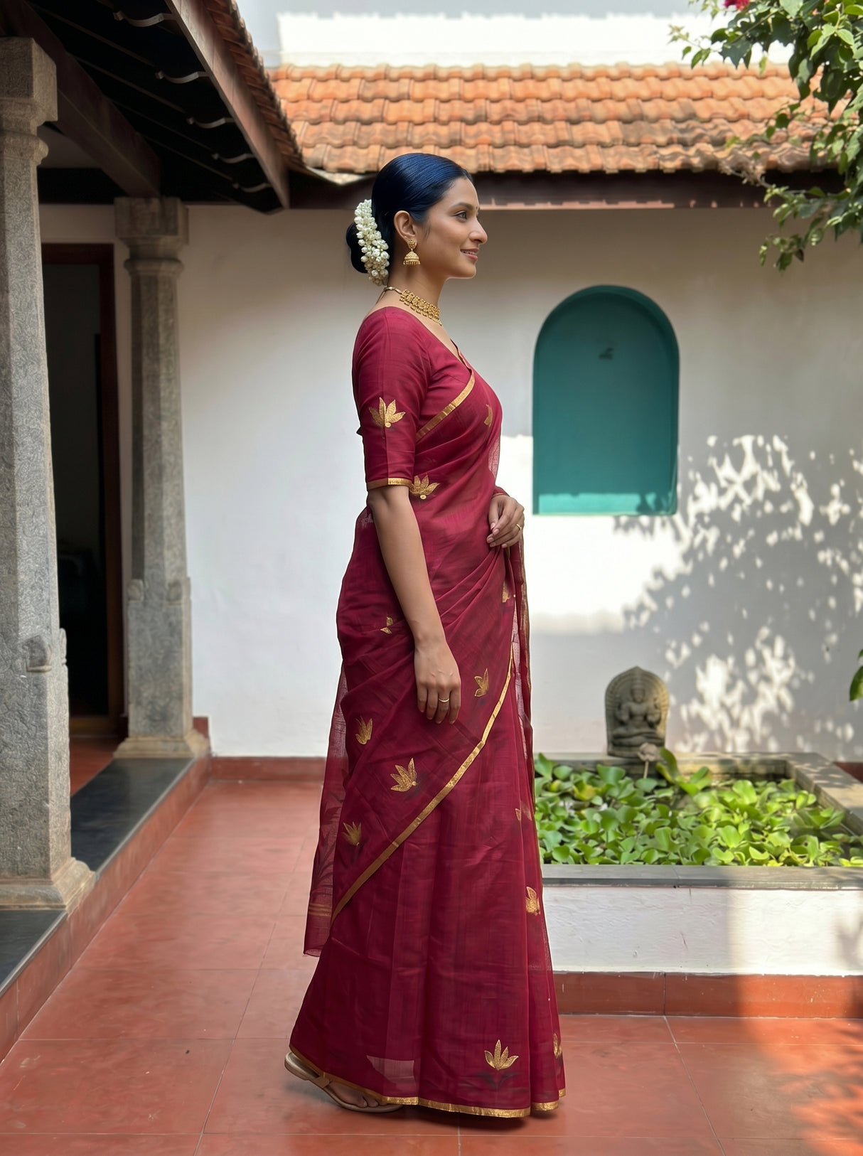MIMOSA Wine Banarasi Art Silk Saree — Close-up of model's face and jewelry