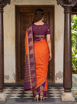 MIMOSA Orange Mysore Silk Crepe Saree — Model smiling showing jewellery
